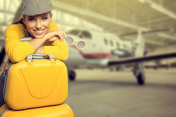 Vintage young female passenger at the airport (shallow DOF; colo