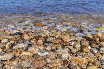 Stony sea shore sea background