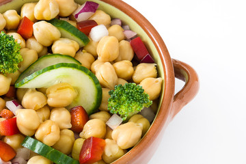 Chickpea salad in brown bowl isolated on white background

