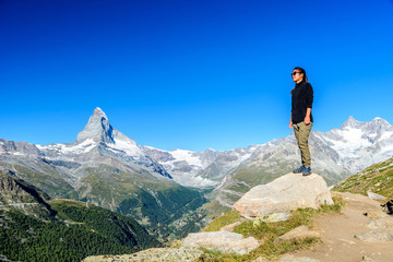 Matterhorn - Hiker in beautiful landscape of Zermatt, Switzerlan