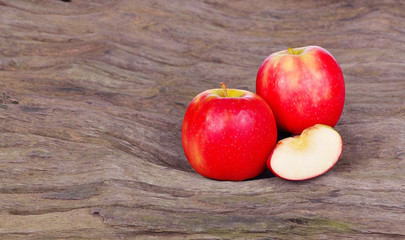 Red apple on wood background