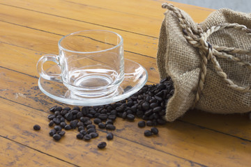 coffee beans and coffee cup on wood background