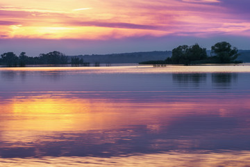 Fototapeta premium Sunset on lake in summer evening
