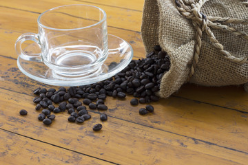 coffee beans and coffee cup on wood background