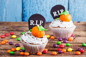 Halloween cupcakes with colored decorations