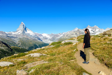 Fototapeta na wymiar Matterhorn - Hiker in beautiful landscape of Zermatt, Switzerland