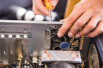 Computer literacy repair men hands, man examines laptop clean thermal paste, dust pollution, fan