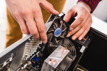 Computer literacy repair men hands, man examines laptop clean thermal paste, dust pollution, fan