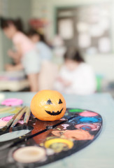 Orange ghost of Halloween, soft focus and color toned.Halloween concept background.