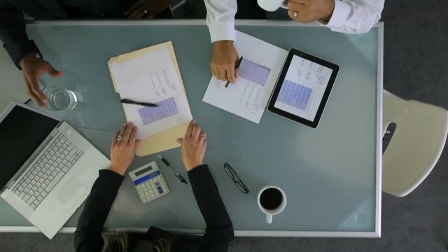 Timelapse overhead shot of business people meeting in office