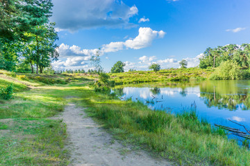 beautiful water lake landscape with sandy road