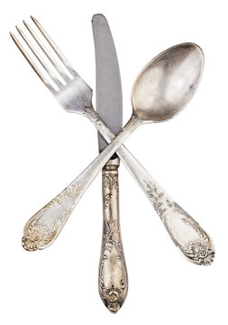 Old Silver Knife Fork And Spoon Crossed Isolated