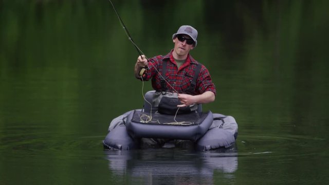 Man fly fishing on lake