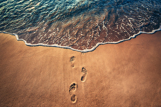 Fototapeta Footsteps on the beach