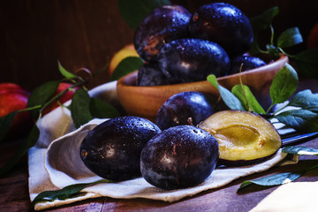 Juicy plum blue, vintage wooden background, selective focus