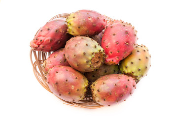 prickly pear (opuntia) fruits in the wicker plate closeup isolat
