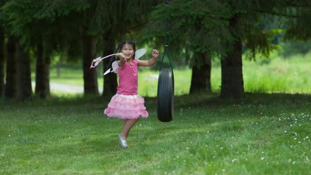 Girl in fairy princess costume on tire swing, shot on Phantom Flex 4K
