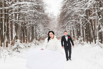 Fototapeta na wymiar wedding couple at the winter day