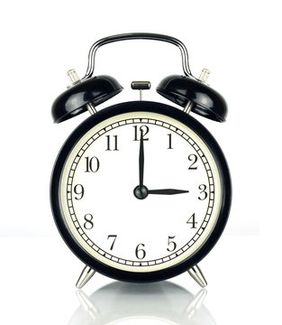 Alarm Clock isolated on white, in black and white, three o'clock.