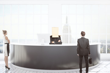 Businesspeople at reception desk