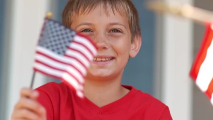Boy waving American flag