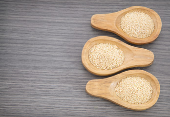 Amaranth seeds in wooden spoon