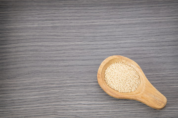 Amaranth seeds in wooden spoon