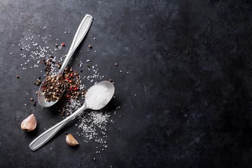 Gordijnen Garlic, pepper and salt spices © karandaev