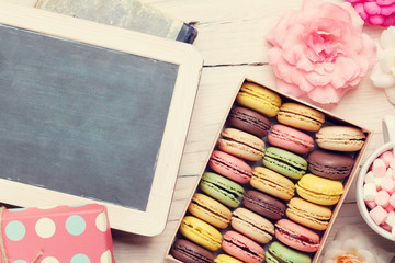 Colorful macaroons and blackboard