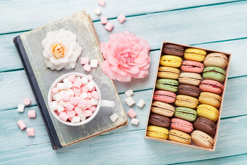 Colorful macaroons in a box and marshmallow