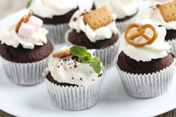 Chocolate cupcakes on a grey wooden table