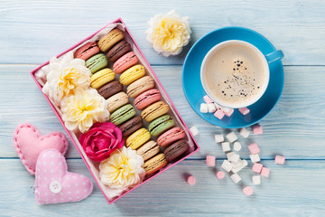 Macaroons and coffee. Sweet macarons in gift box