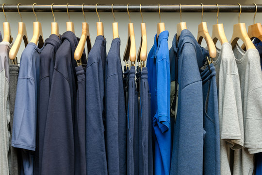 Various Men's Clothing On A Wooden Hanger
