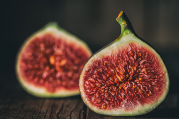 Fresh fruits, figs on an old wooden table. Ripe fig.