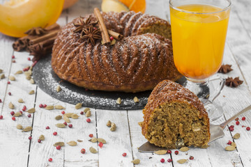 homemade cake with pumpkin on wooden background