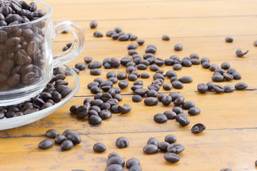 coffee beans and coffee cup on wood background
