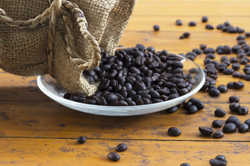 Fototapeta na wymiar coffee beans and cofee bag on white background