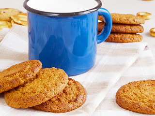 Mug of milk with cookies
