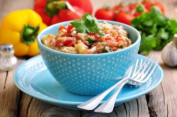 Appetizer (salad) of roasted eggplant, peppers, tomatoes, onions, garlic and coriander.