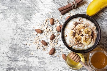 oatmeal with banana, honey, nuts and cinnamon. healthy breakfast