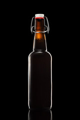 Swing top bottle of light beer with clipping path isolated on black gradient background