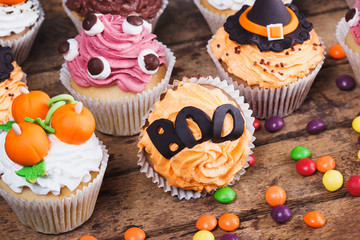 Halloween cupcakes with colored decorations