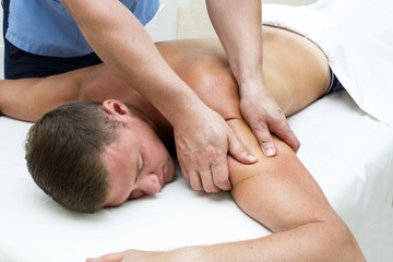 young man on wellness treatments sports massage