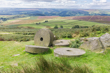 Abandoned millstones at Stanage Edge in Derbyshire, England.