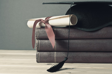 Graduation Mortarboard, Scroll and Books - Faded Tones - obrazy, fototapety, plakaty