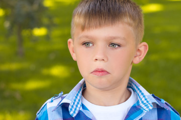 Portrait close . The frightened boy . Beautiful ,little boy .