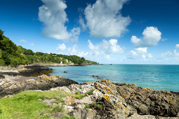 Fototapeta na wymiar Blue sea with clouds seen from the island of Jersey Channel