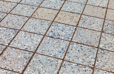 Grey paving stones as background close up