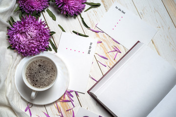 Word relax with cup of coffee and pink flowers