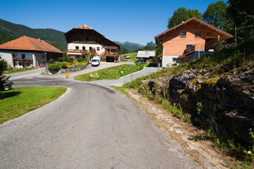 Fototapeta na wymiar Village road and houses